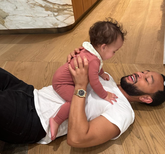 John Legend fatherly moment  with baby Est at 11 months