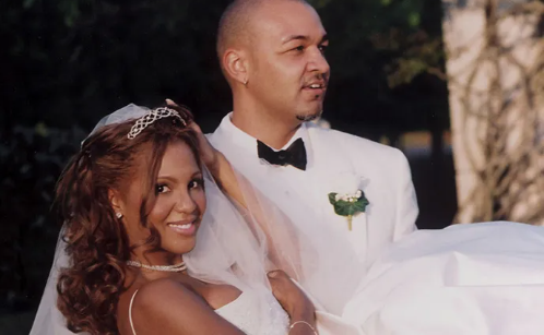 Braxton and her ex husband Keri Lewis on their wedding 