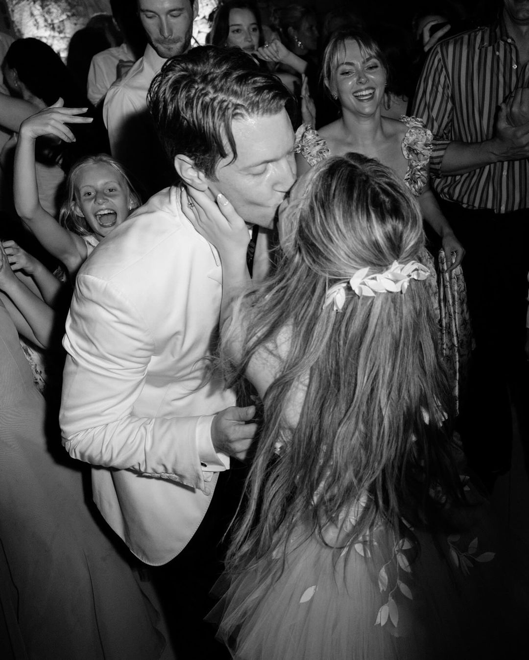 Steven Piet kissing his bride Joey King