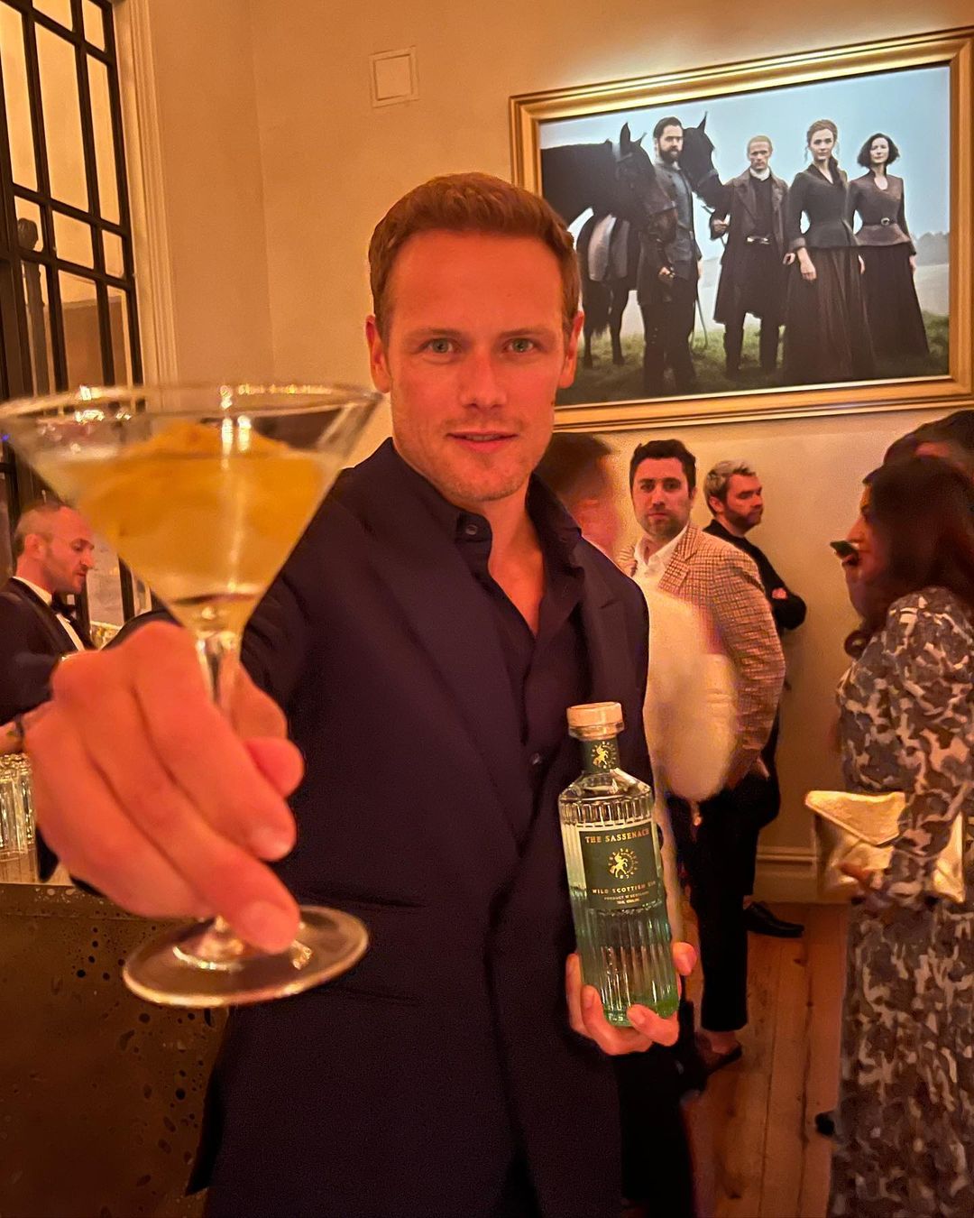 Sam Heughan showcasing his spirit brand