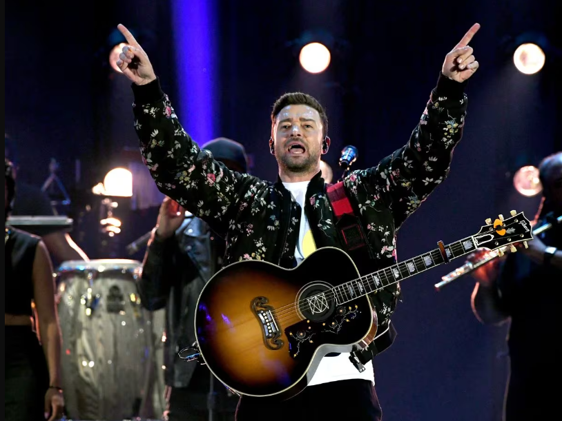 Justin Timberlake performing on   his concert 