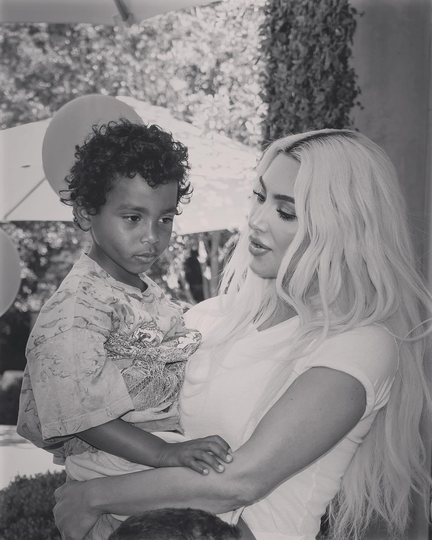 Kim Kardashian carrying her  son Psalm West on his 5th birthday