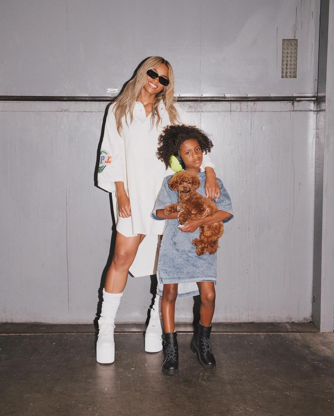 Ciara and daughter at a tour