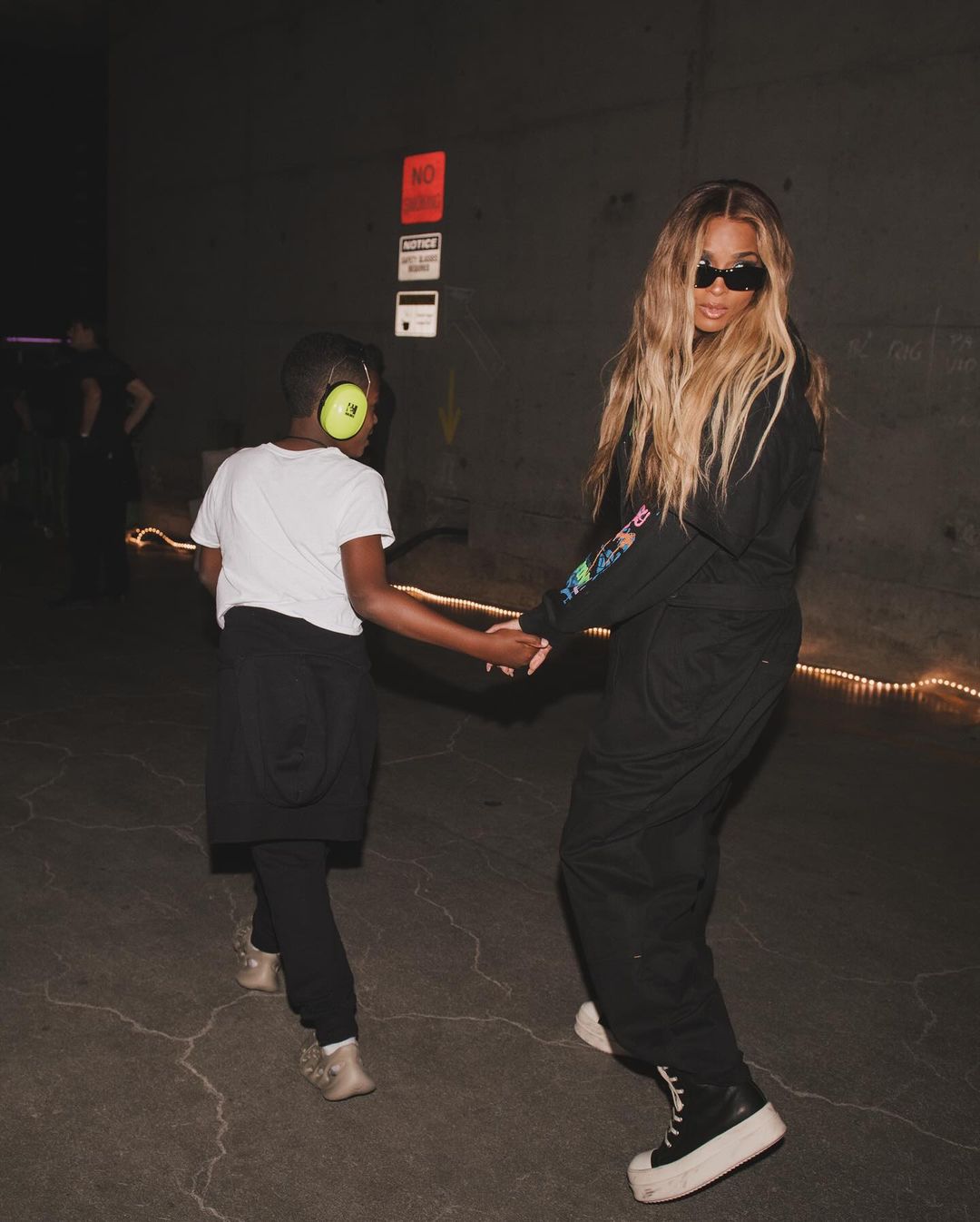 Ciara and her daughter at a tour