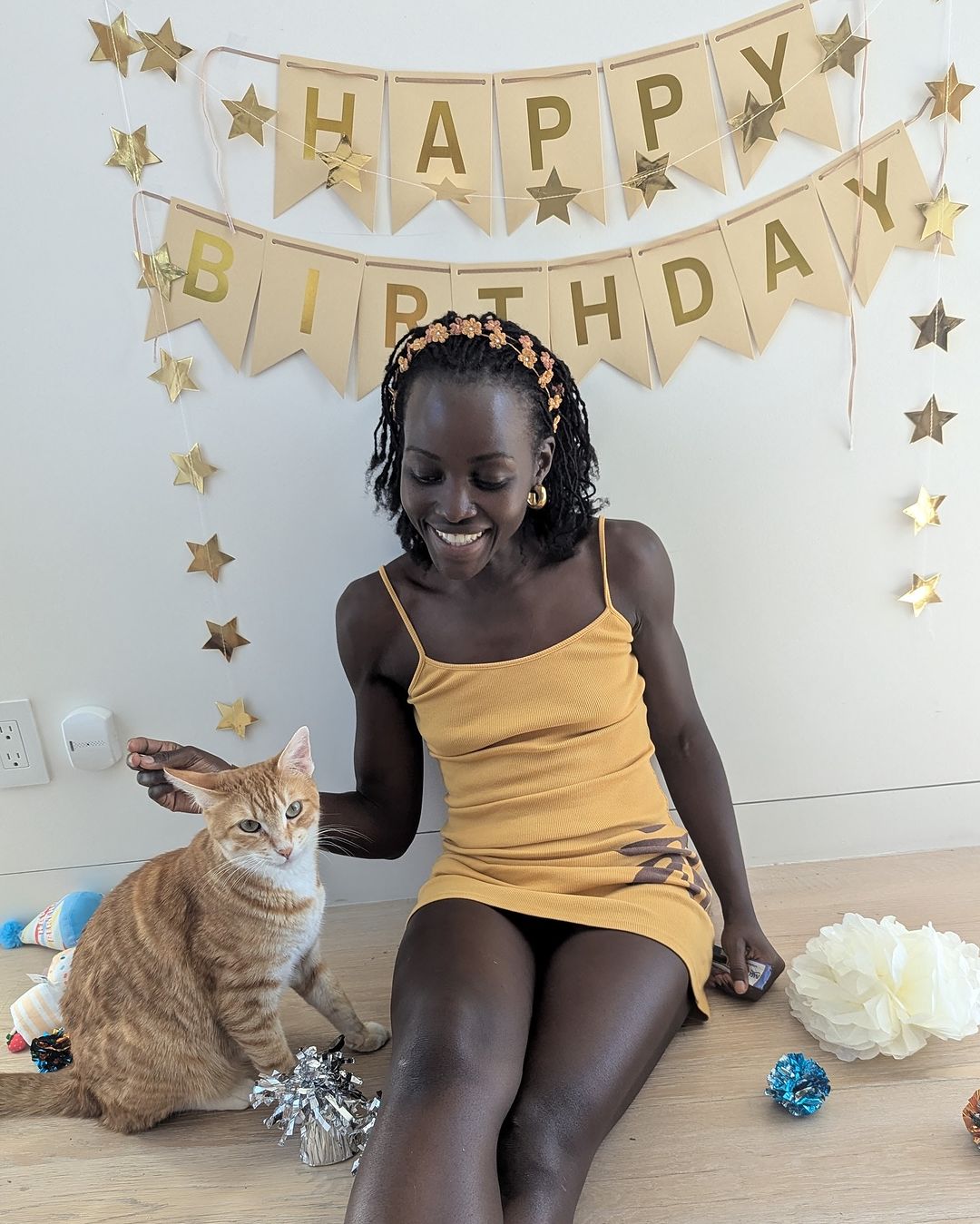 Lupita Nyong'o cat Yoyo 3rd birthday celebration