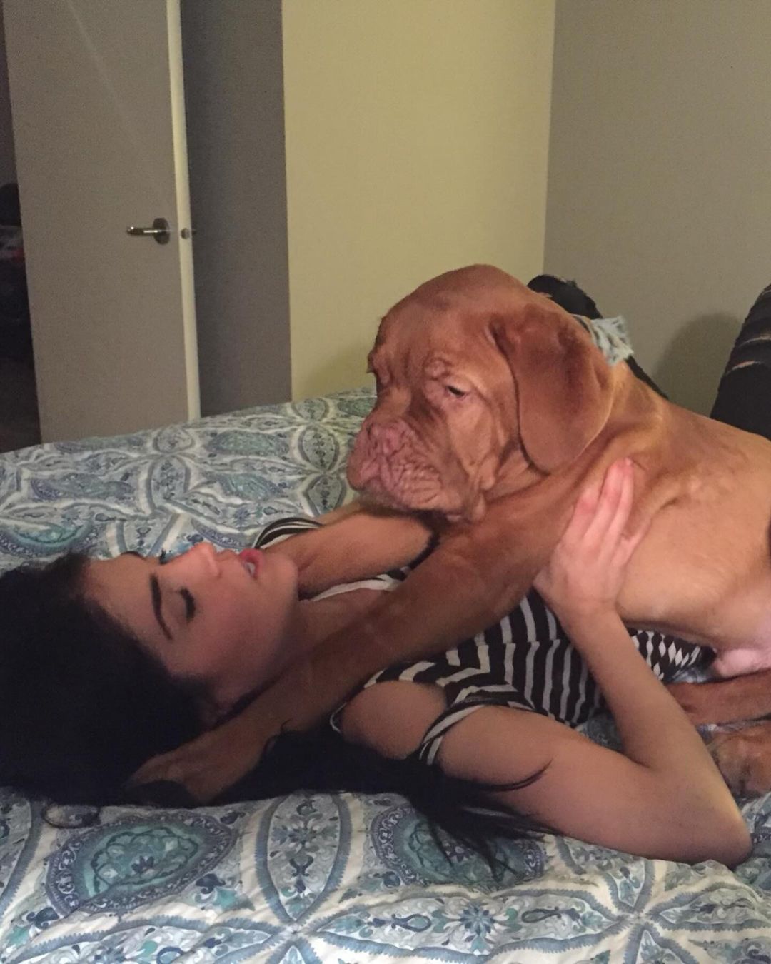 Marie Avgeropoulos playing with her dog Soleil Avgeropoulos