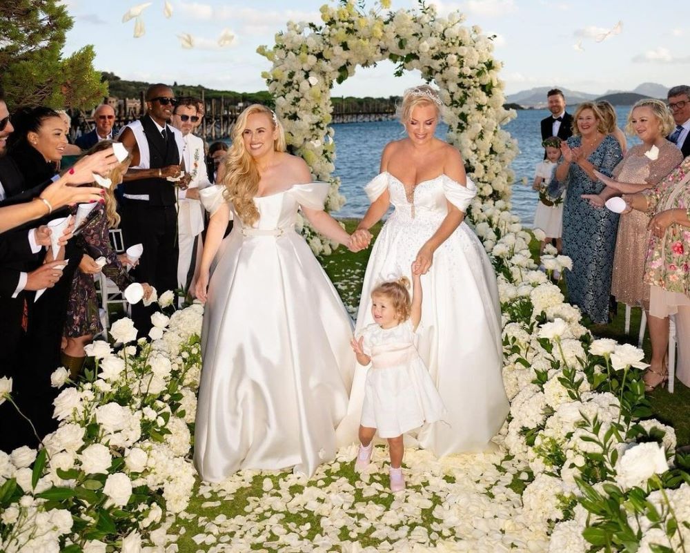 Gorgeous wedding  photos of actress Rebel Wilson, her bride and their daughter. 