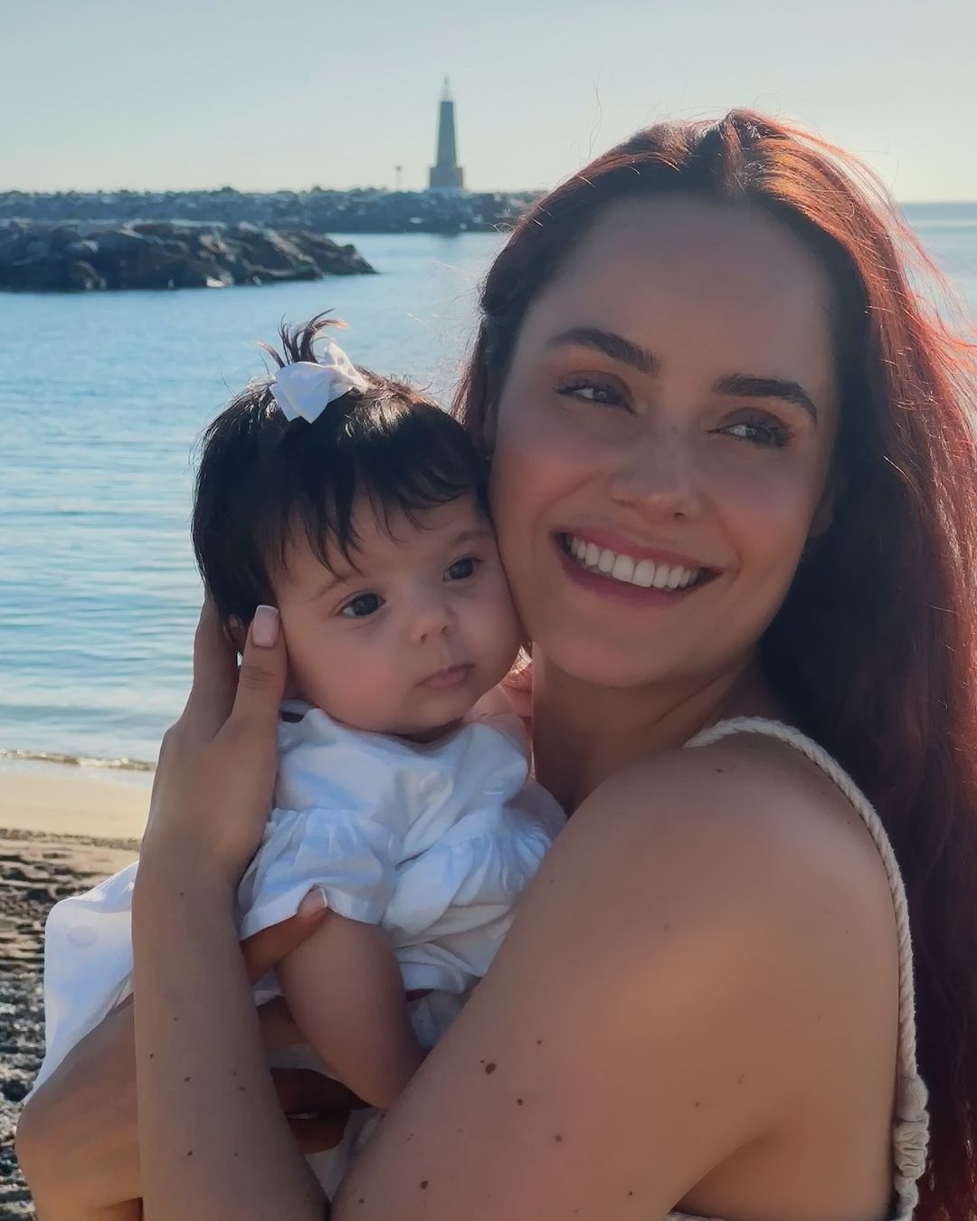 Ana Luciia Dominguez,  and their 3 months old daughter at the beach