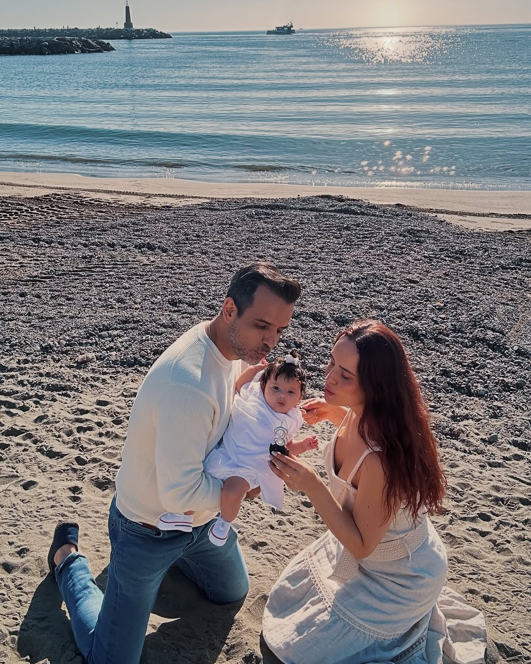 Ana Luciia Dominguez, her husband Jorge Cardenas and their 3 months old daughter at the beach