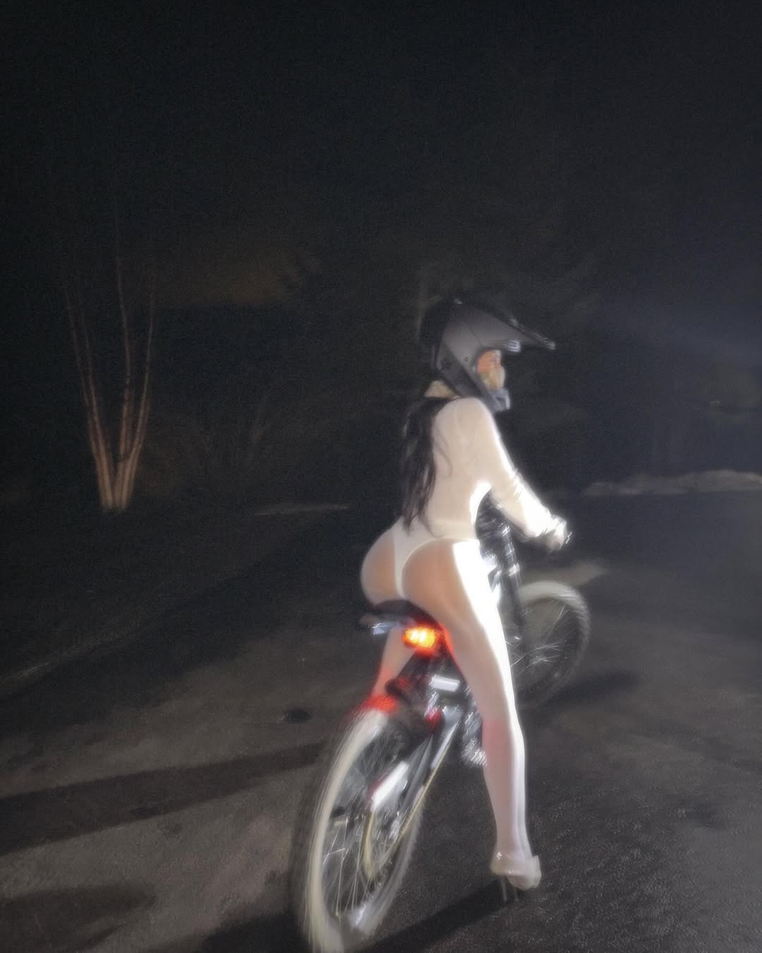 Kim Kardashian riding a bike 